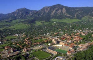 Aerial view of a town and mountains.