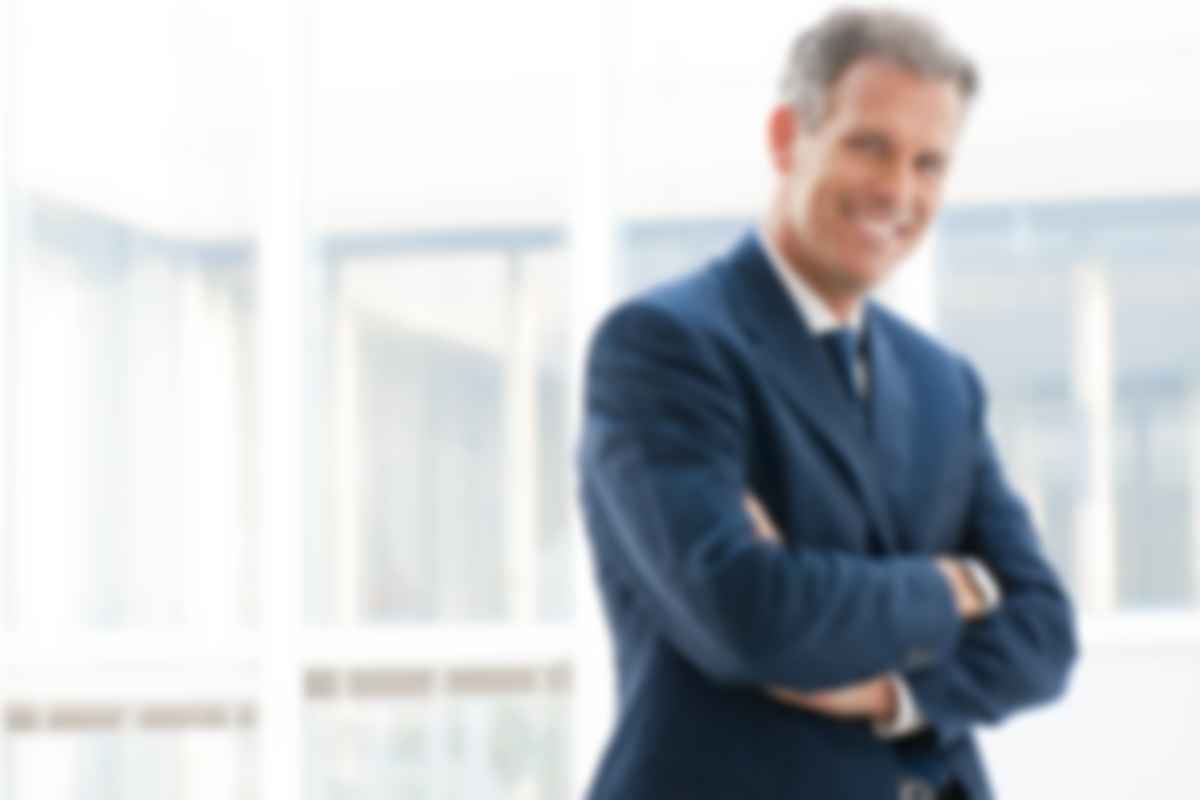 Blurry image of a man in suit.